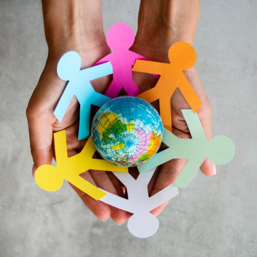 top-view-origami-chain-people-with-globe